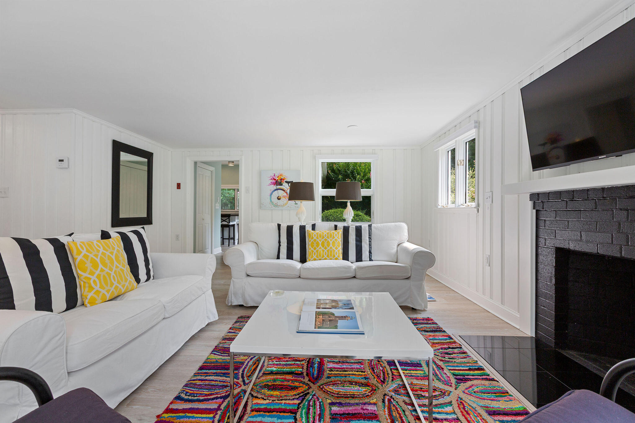 75 Monument Road Orleans, MA 02653 - Photo 41 of 61 a living room with furniture and a rug