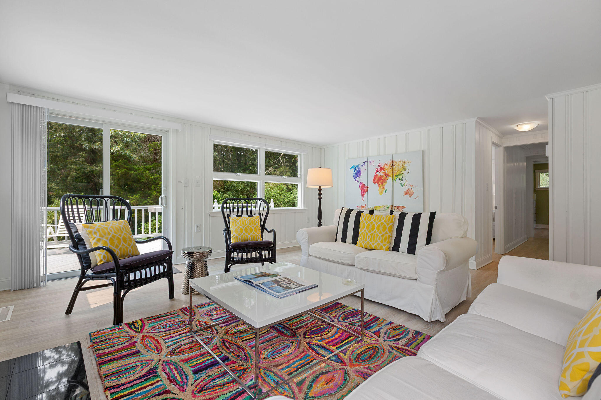 75 Monument Road Orleans, MA 02653 - Photo 42 of 61 a living room with furniture and a floor to ceiling window