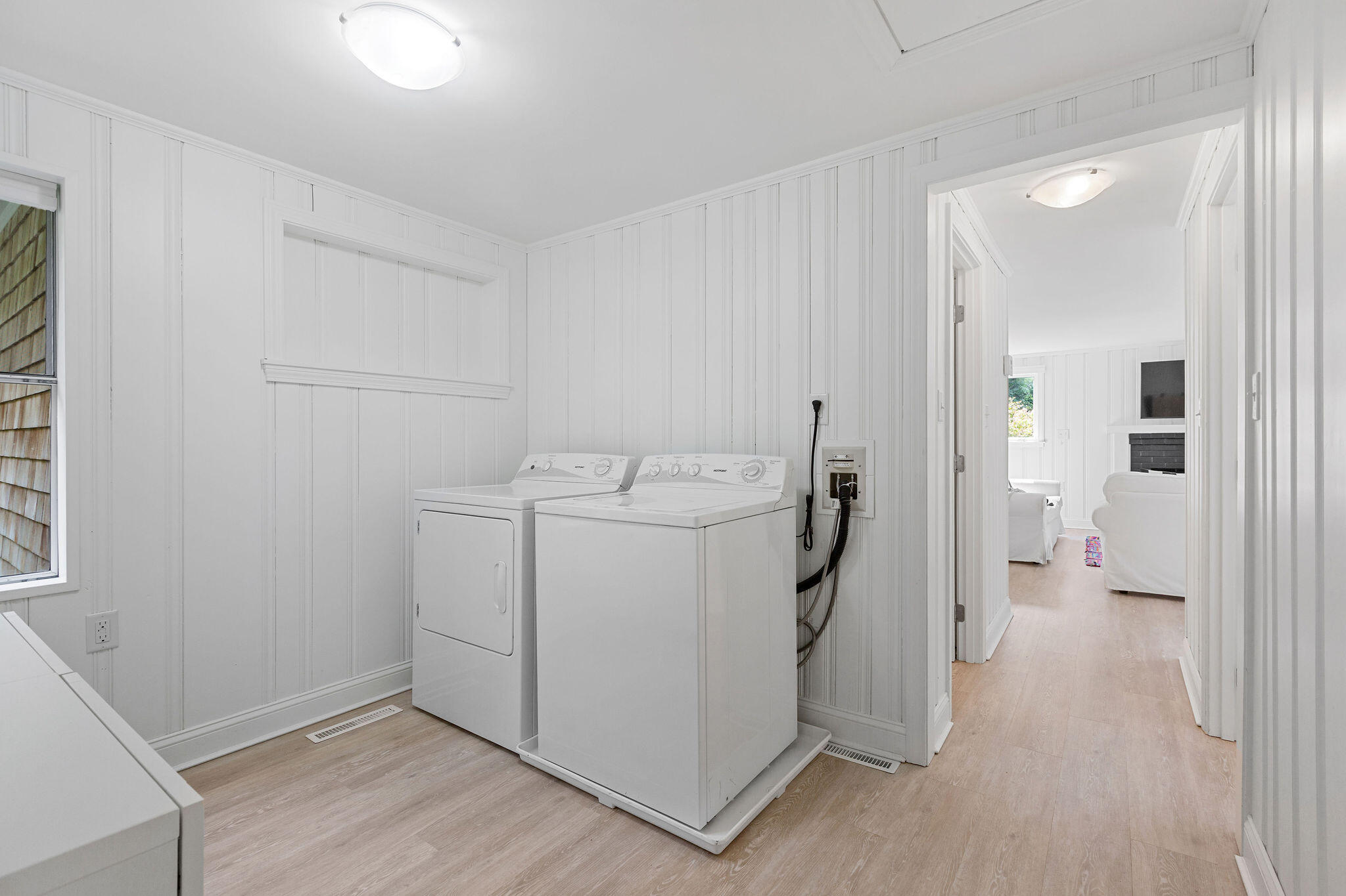 75 Monument Road Orleans, MA 02653 - Photo 44 of 61 a utility room with cabinets washer and dryer