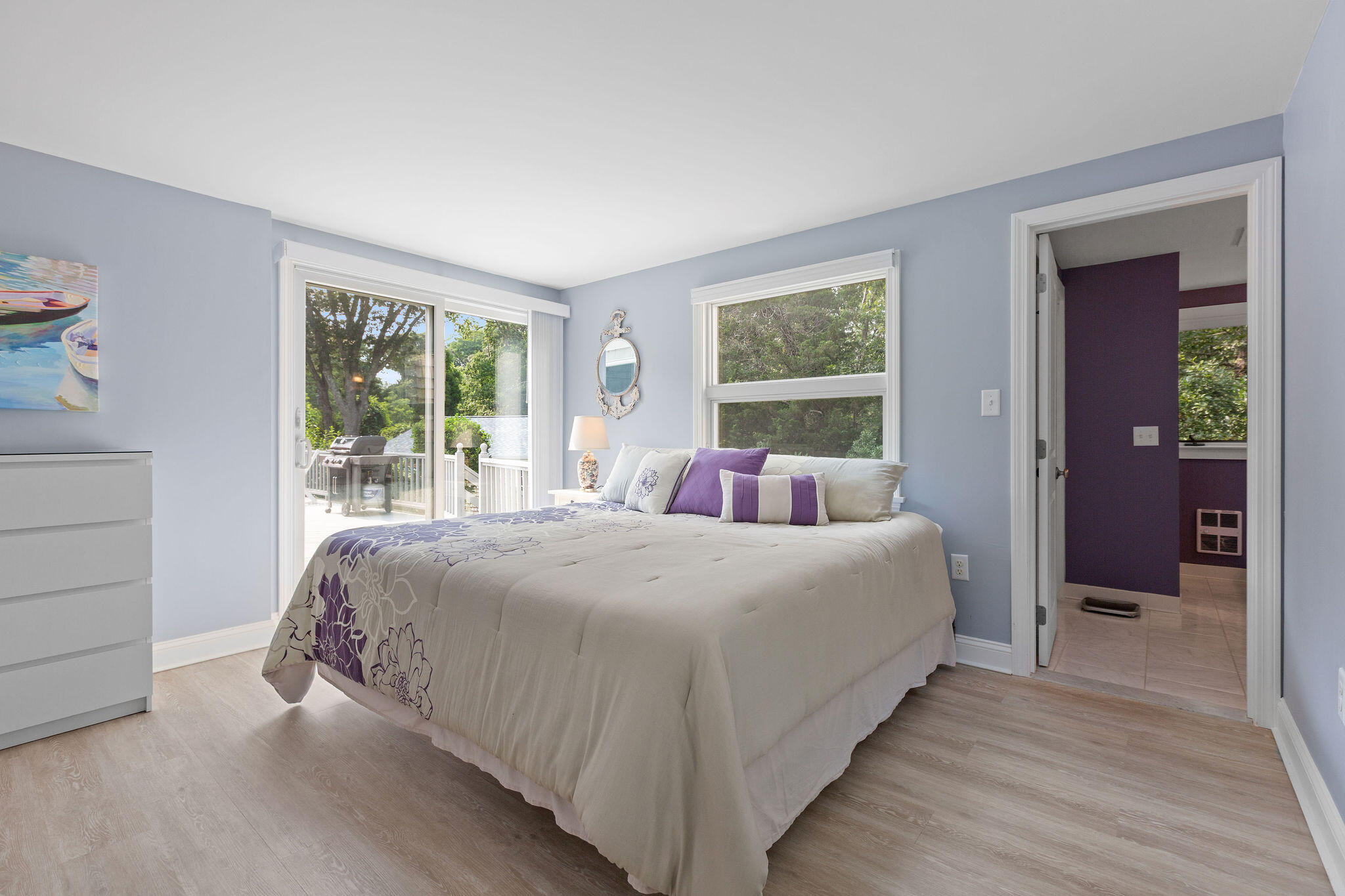 75 Monument Road Orleans, MA 02653 - Photo 55 of 61 a bedroom with a bed and large windows