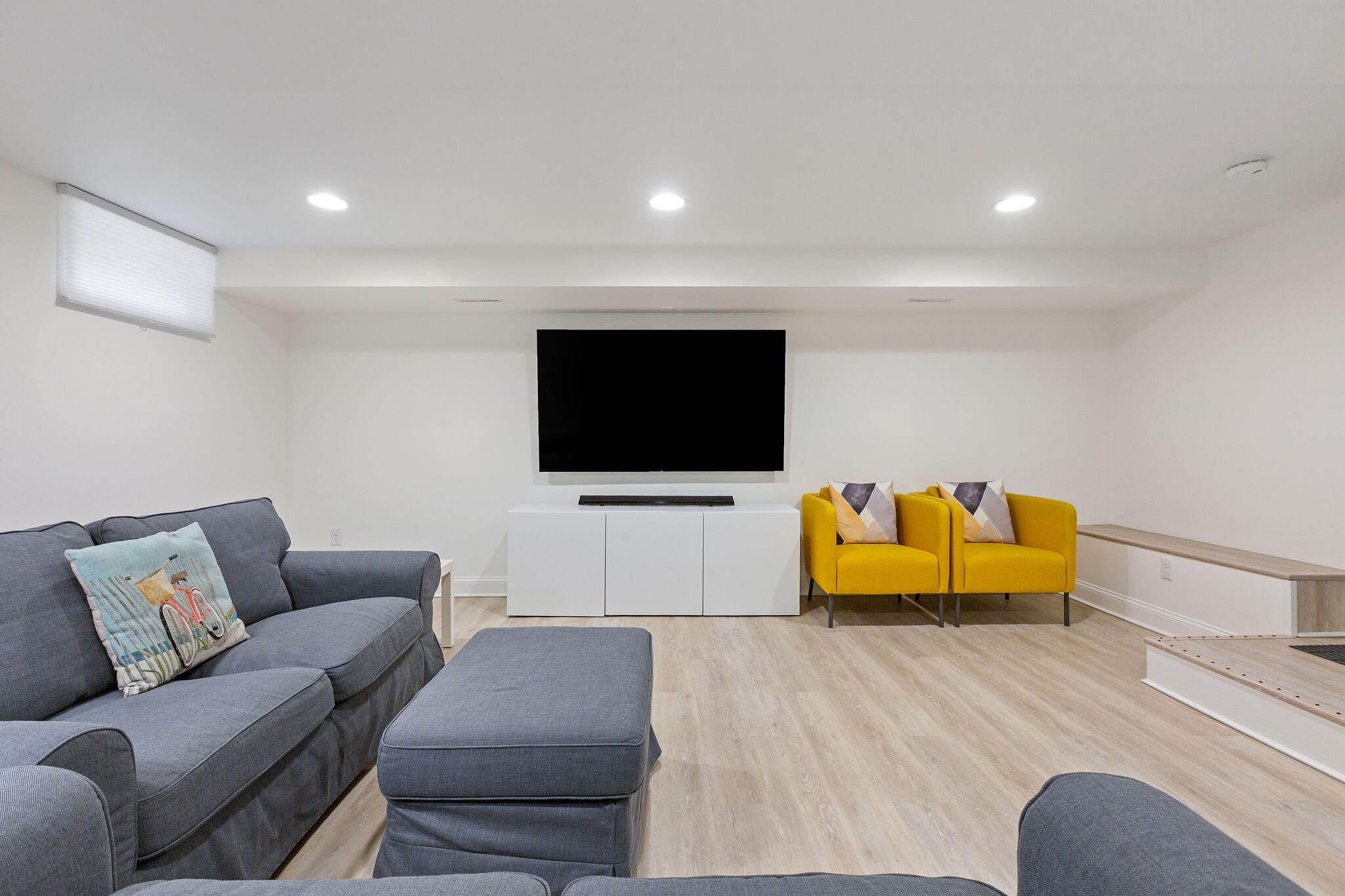 75 Monument Road Orleans, MA 02653 - Photo 58 of 61 a living room with furniture and a flat screen tv