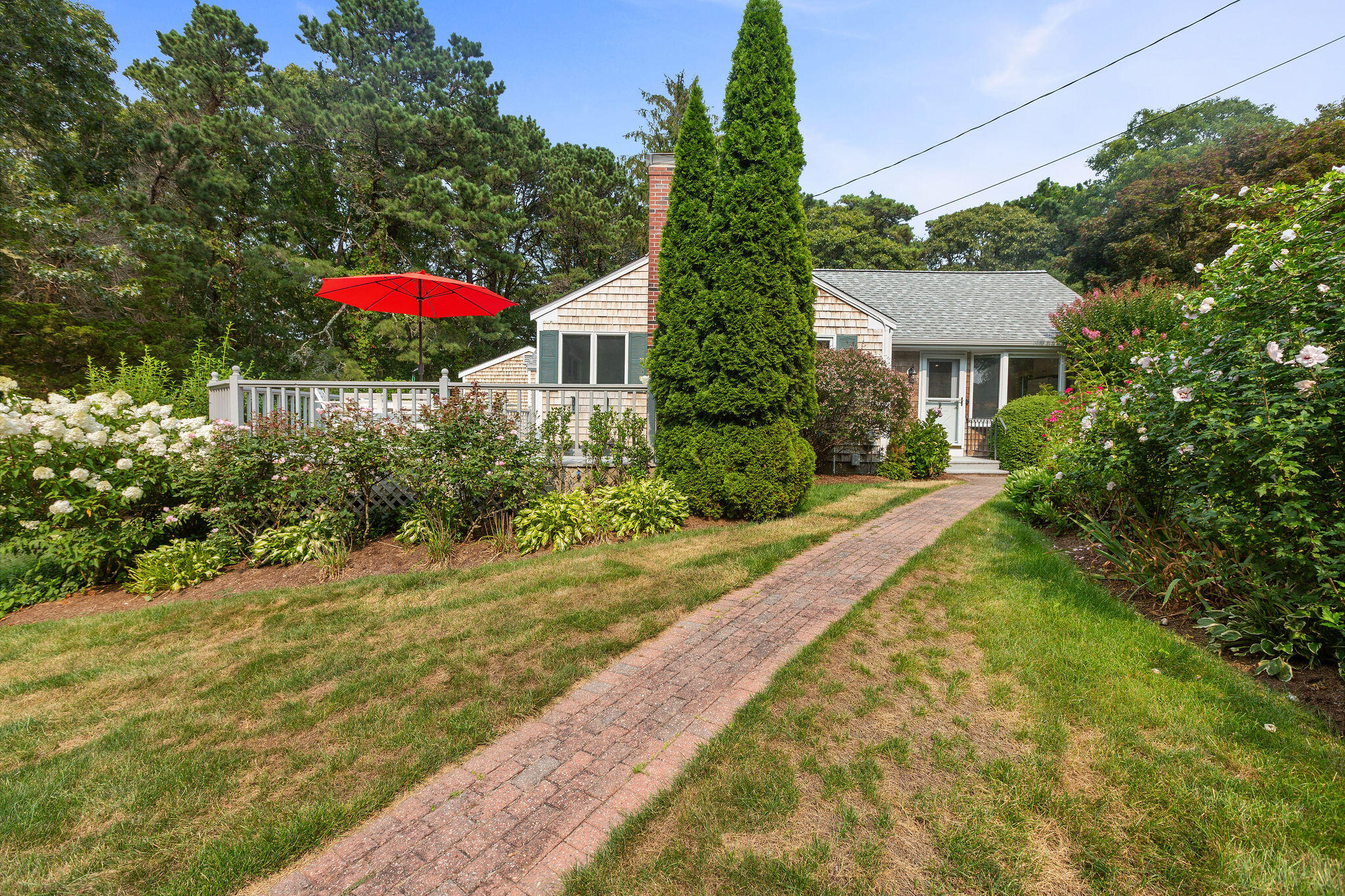 75 Monument Road Orleans, MA 02653 - Photo 7 of 61 a view of a house with backyard and garden