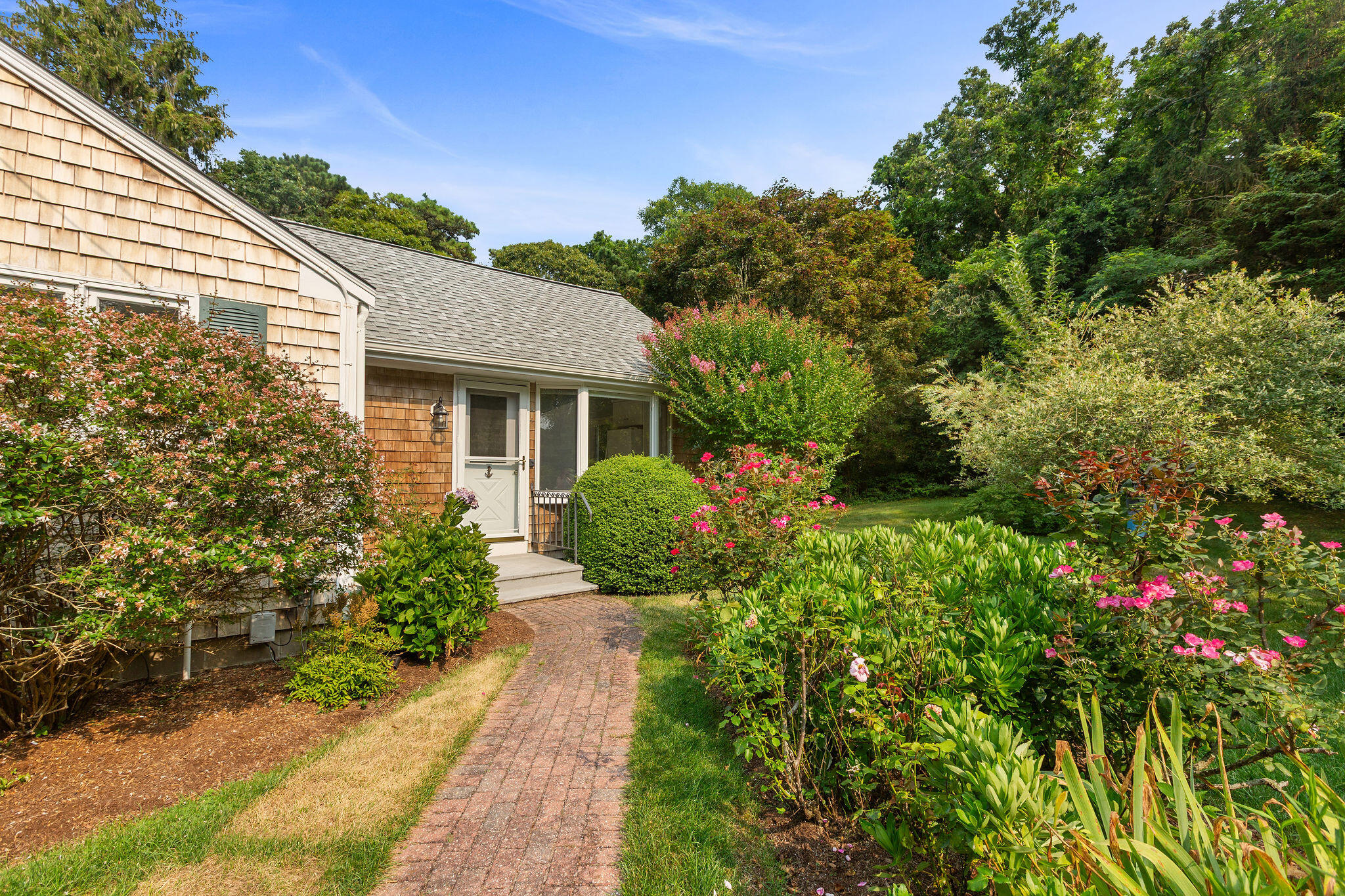 75 Monument Road Orleans, MA 02653 - Photo 8 of 61 a house that has a lot of plants in it
