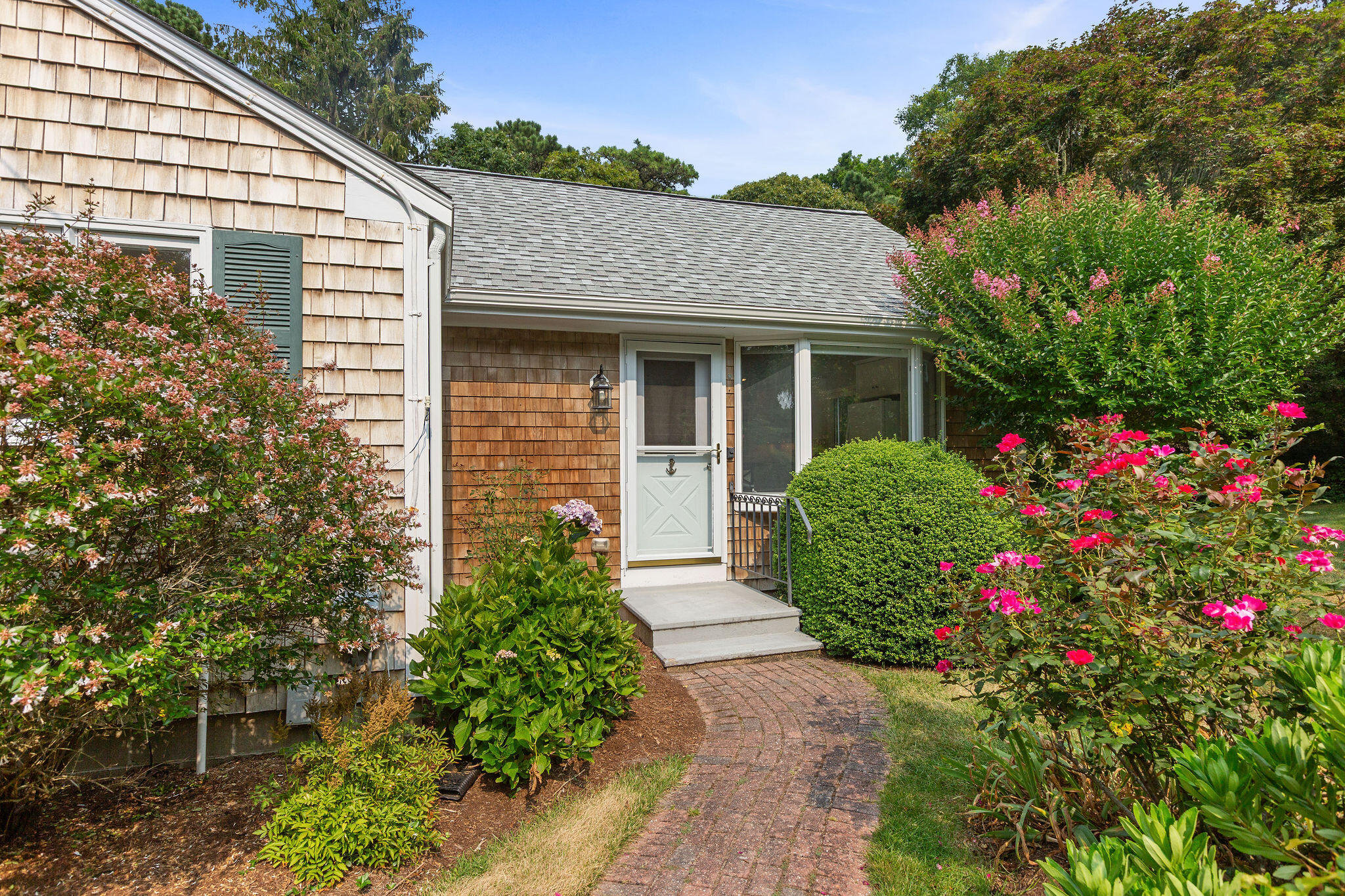75 Monument Road Orleans, MA 02653 - Photo 9 of 61 a view of a house with potted plants