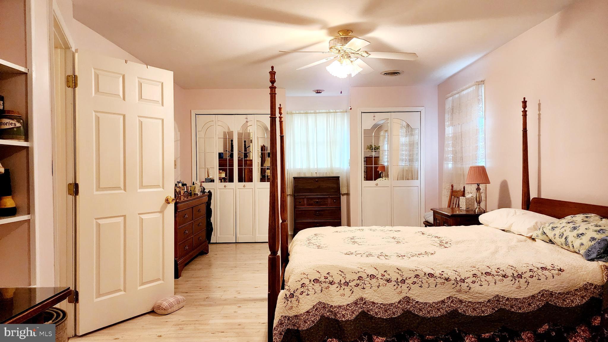 140 Water Street Fairfield, PA 17320 - Photo 15 of 40 a bedroom with a bed and a chandelier