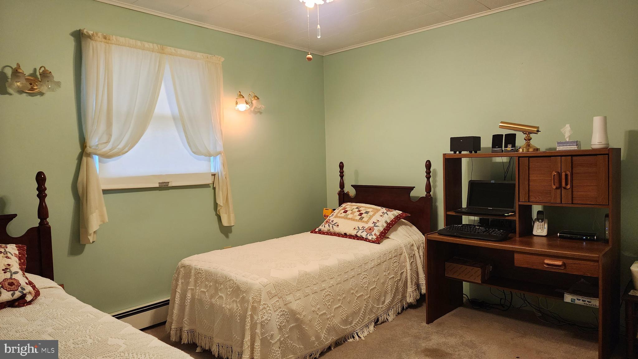 140 Water Street Fairfield, PA 17320 - Photo 17 of 40 a bedroom with a bed and a flat tv screen on the dresser