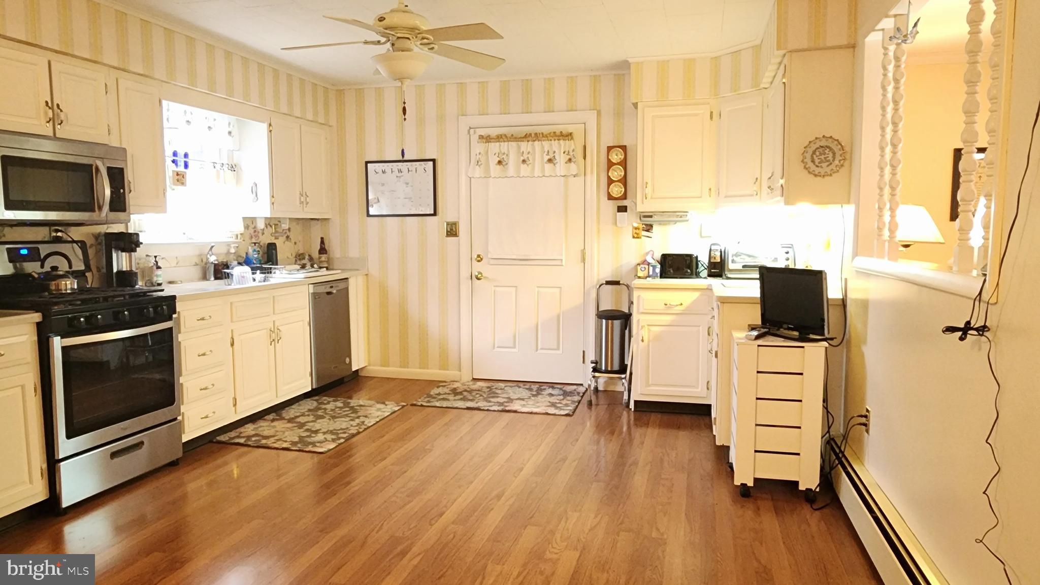 140 Water Street Fairfield, PA 17320 - Photo 24 of 40 a kitchen with stainless steel appliances a stove top oven and a refrigerator