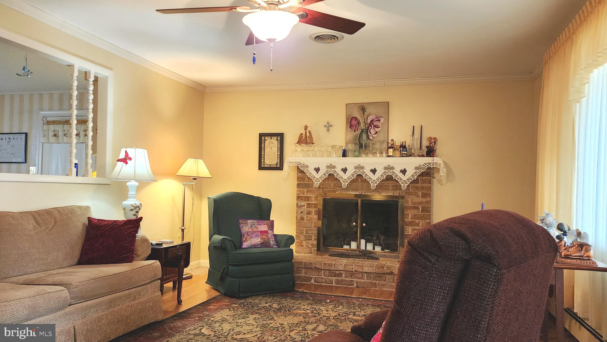 140 Water Street Fairfield, PA 17320 - Photo 3 of 40 a living room with furniture and a fireplace