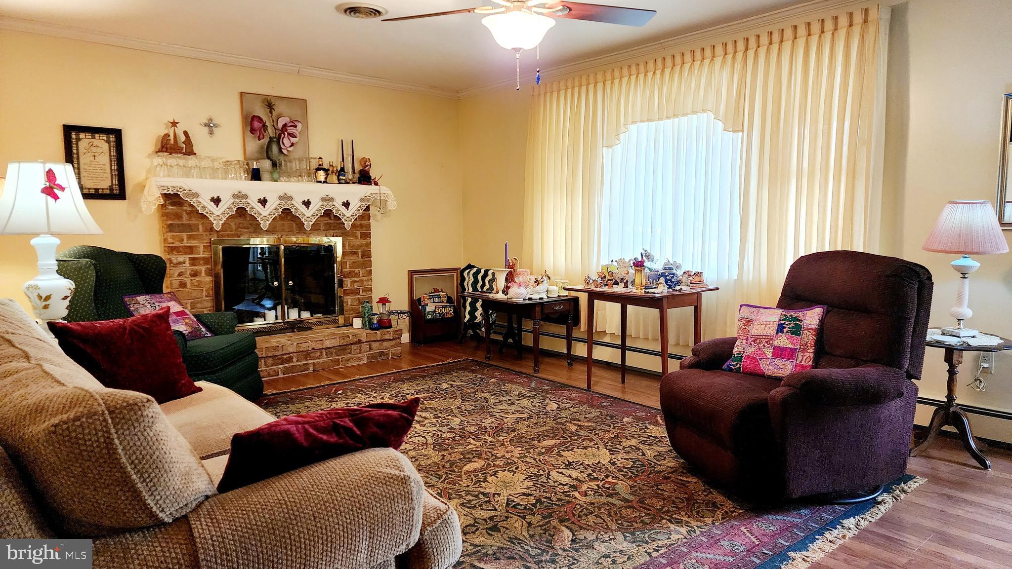 140 Water Street Fairfield, PA 17320 - Photo 4 of 40 a living room with furniture and a fireplace
