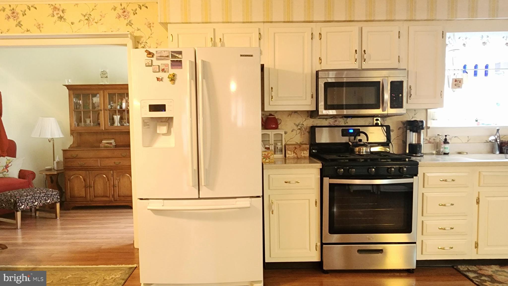 140 Water Street Fairfield, PA 17320 - Photo 9 of 40 a kitchen with stainless steel appliances a stove a microwave and a refrigerator
