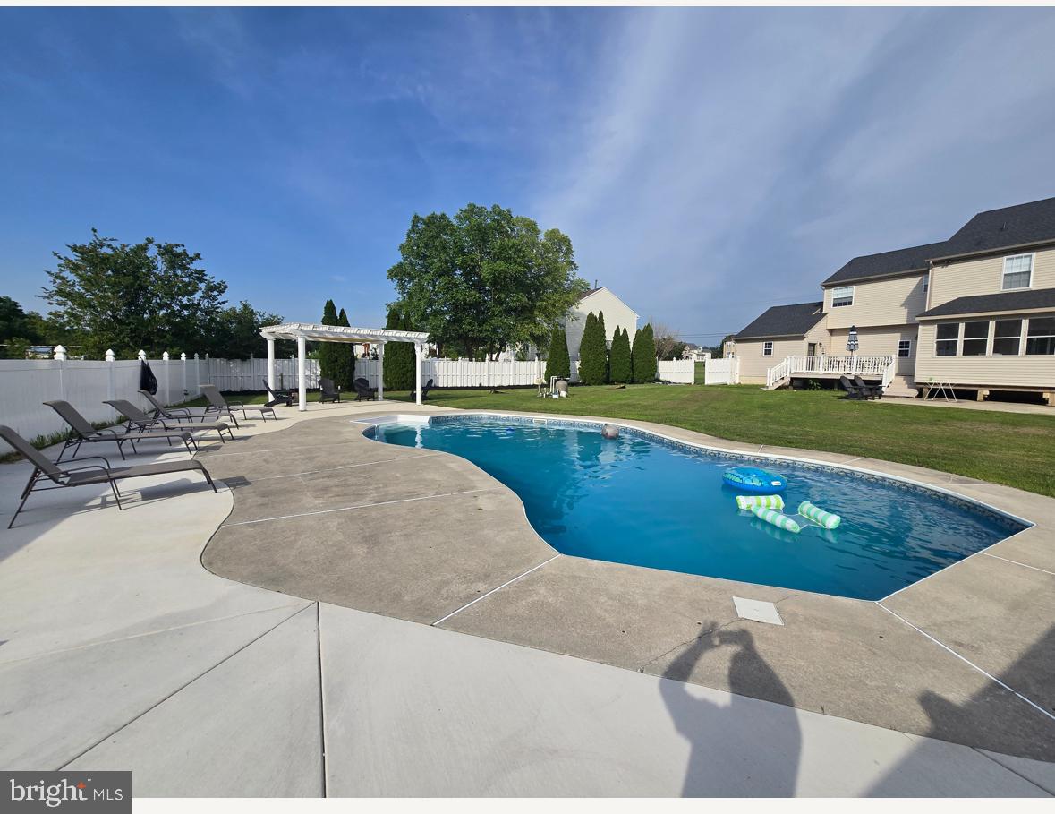 361 Rainey Road Swedesboro, NJ 08085 - Photo 3 of 17 a view of a swimming pool with a lounge chairs