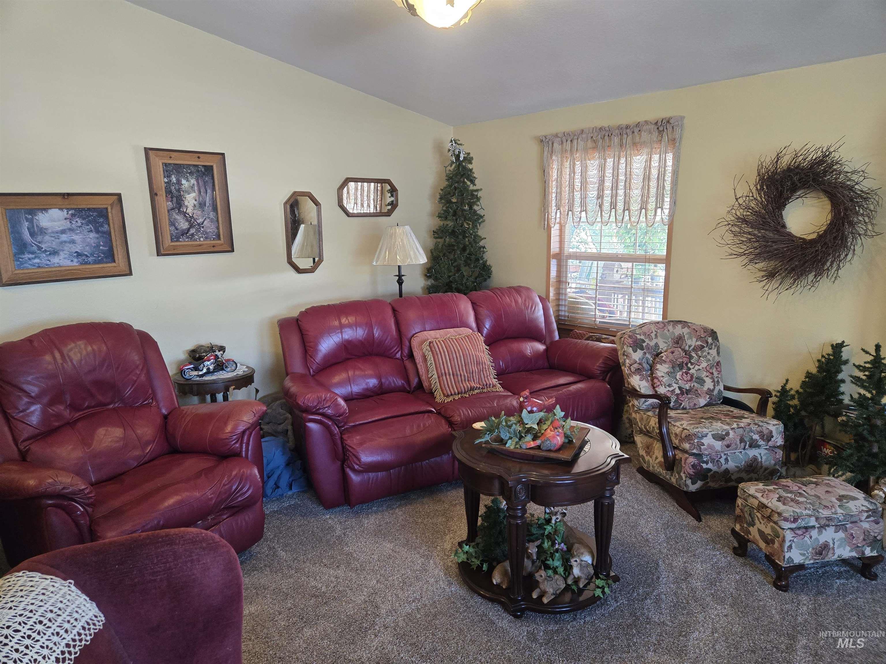 254 Lackey Road Weippe, ID 83553 - Photo 4 of 37 Living room featuring carpet floors