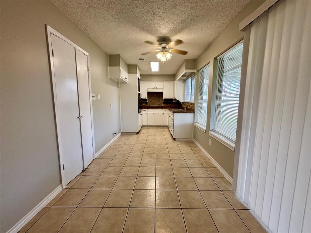 337 Apache Trail Keller, TX 76248 - Photo 2 of 16 a large bathroom with a glass door shower a sink and dishwasher
