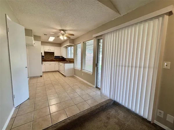 a kitchen with stainless steel appliances a refrigerator and a stove top oven