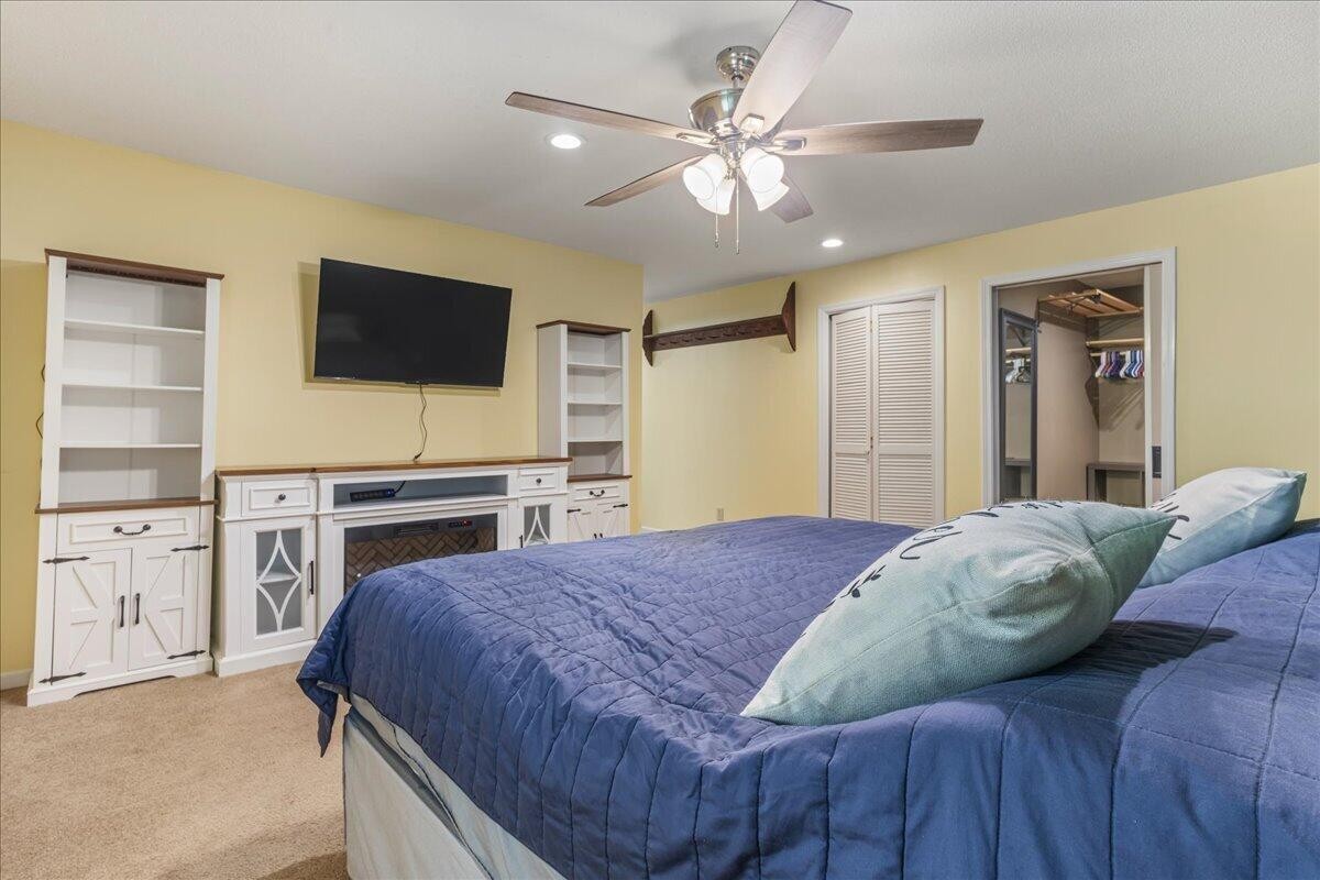 2522 Cindy Street Athens, TN 37303 - Photo 18 of 36 a bedroom with a bed and a flat screen tv
