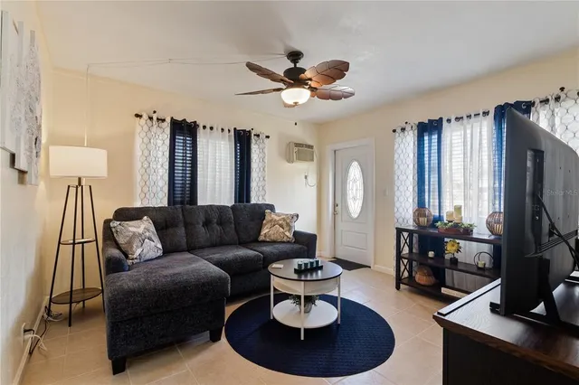 a view of a workspace with furniture and a potted plant