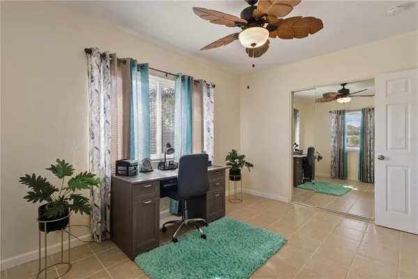 a bedroom with furniture and a chandelier
