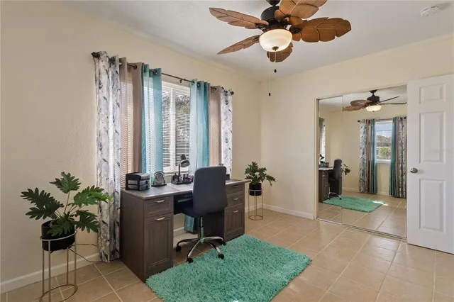 a bedroom with furniture and a chandelier