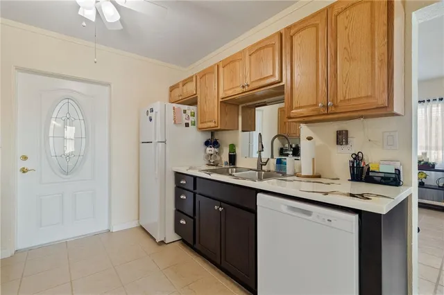 a white refrigerator freezer sitting inside of a kitchen