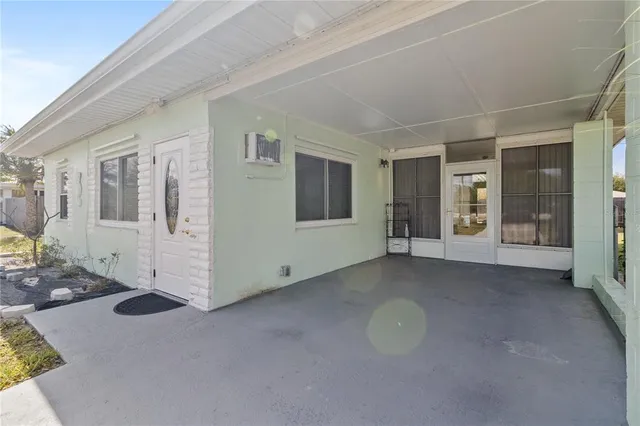 a view of a livingroom with an empty space and wooden floor