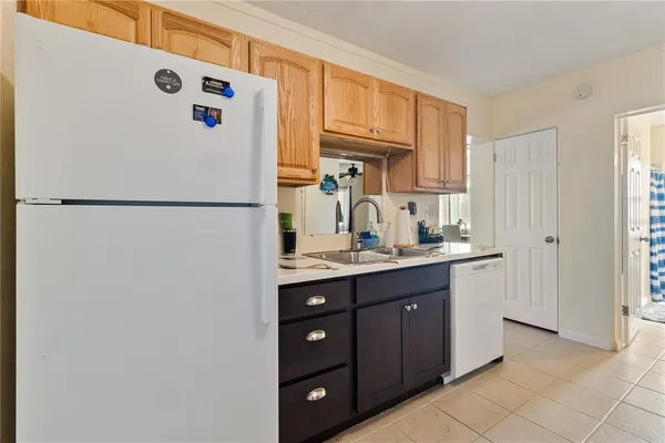 a kitchen with stainless steel appliances granite countertop a sink a stove and microwave