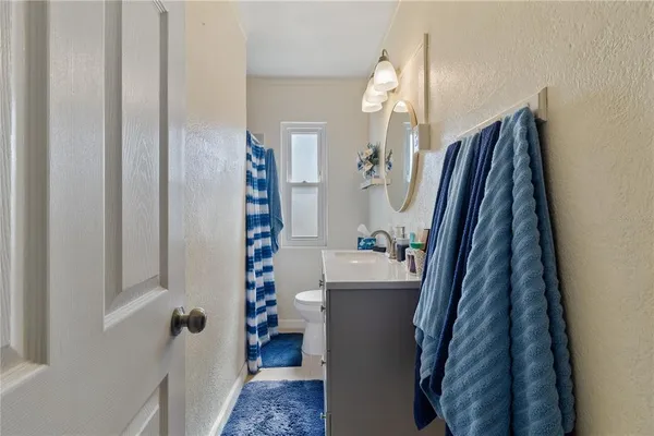 a bedroom with a bed and a dresser in it