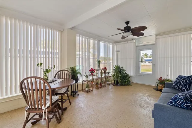 a view of a livingroom with furniture and a potted plant