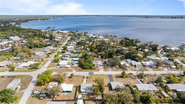 a living room with furniture a rug and a fireplace