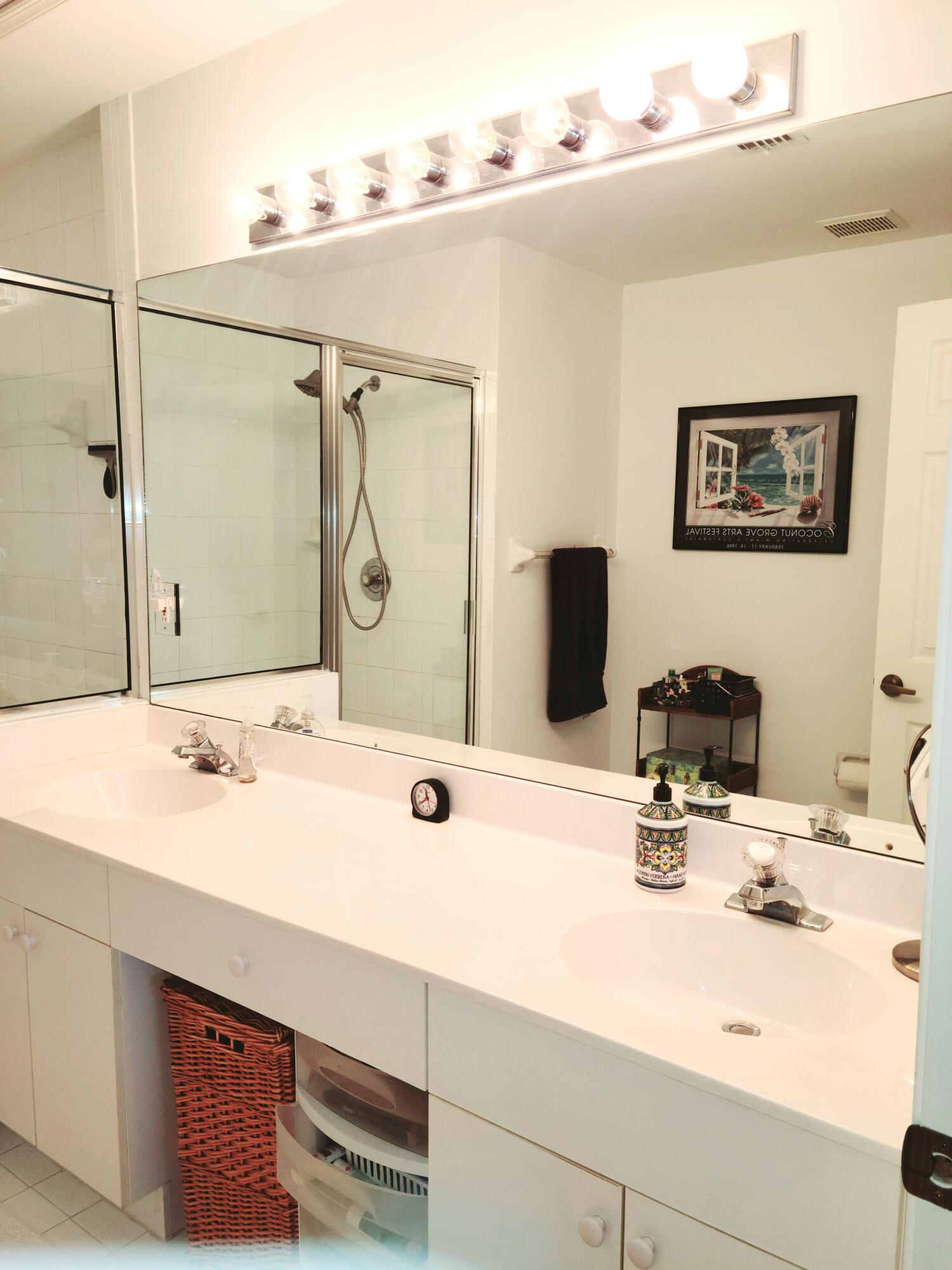 5121 Sabal Gardens Lane, Unit 2 Boca Raton, FL 33487 - Photo 16 of 25 a bathroom with a sink and a mirror