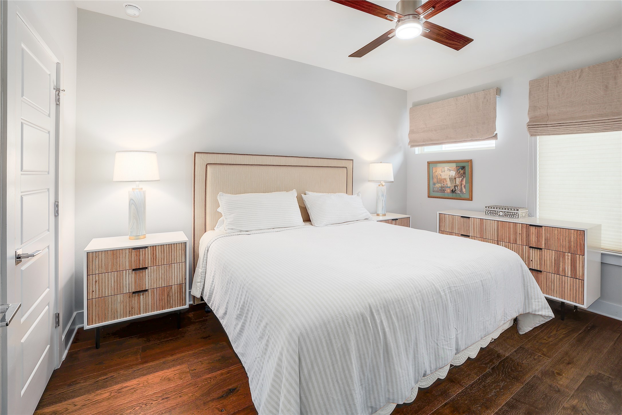 1205 Elm Street, Unit 8 Austin, TX 78703 - Photo 14 of 26 Spacious primary bedroom featuring ceiling fan and walk-in closet.