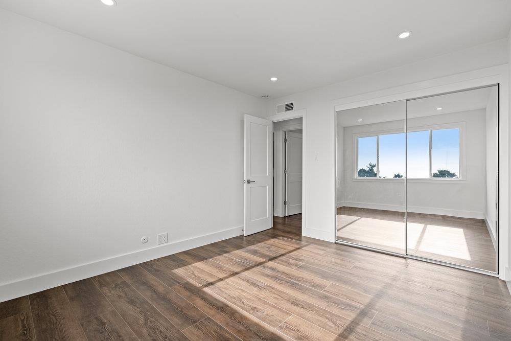 418 Imperial Drive Pacifica, CA 94044 - Photo 44 of 70 wooden floor in an empty room with a window
