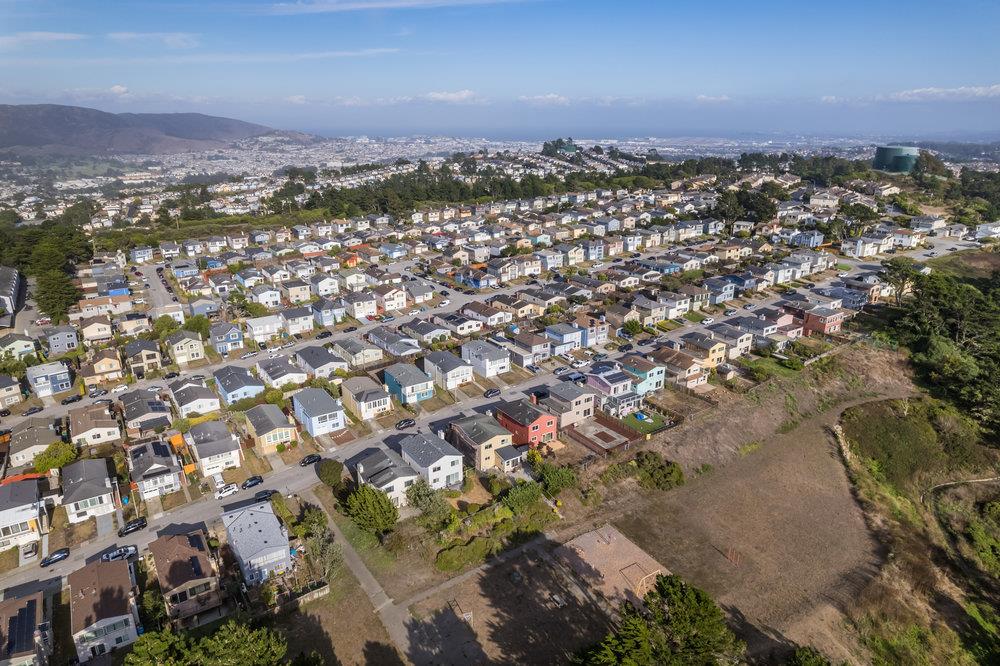 418 Imperial Drive Pacifica, CA 94044 - Photo 68 of 70 an aerial view of residential building with parking and yard