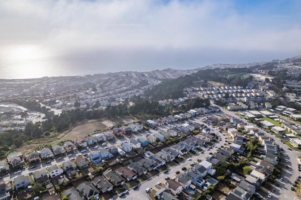 418 Imperial Drive Pacifica, CA 94044 - Photo 70 of 70 an aerial view of house with yard and mountain view in back