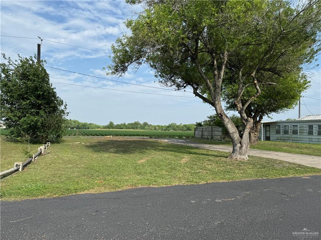 26826 Tamm Lane Harlingen, TX 78552 - Photo 2 of 2 a view of a lake with a big yard and large trees