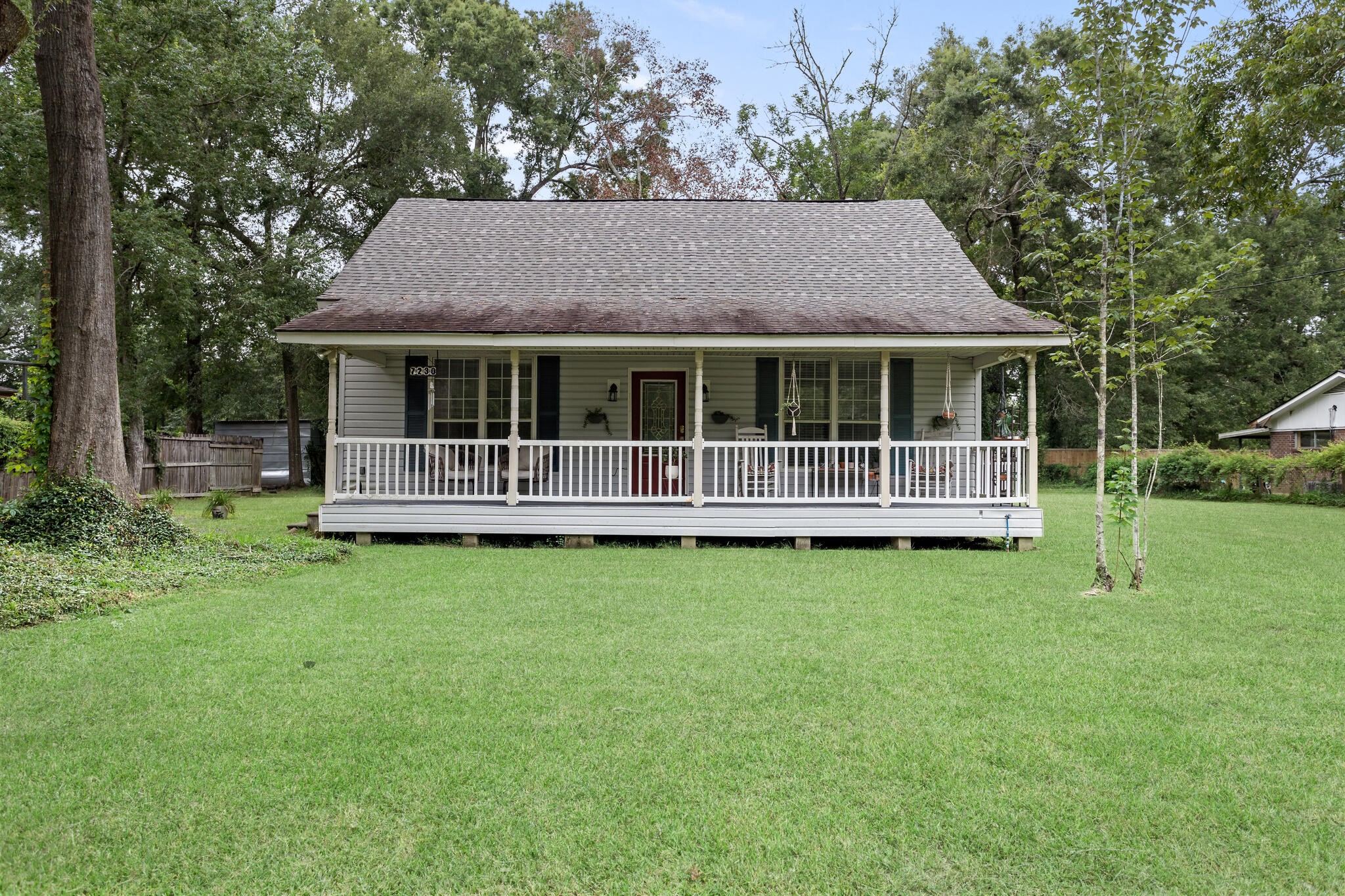 7230 Bythewood Road Beaumont, TX 77713 - Photo 1 of 35 a view of a house with a garden
