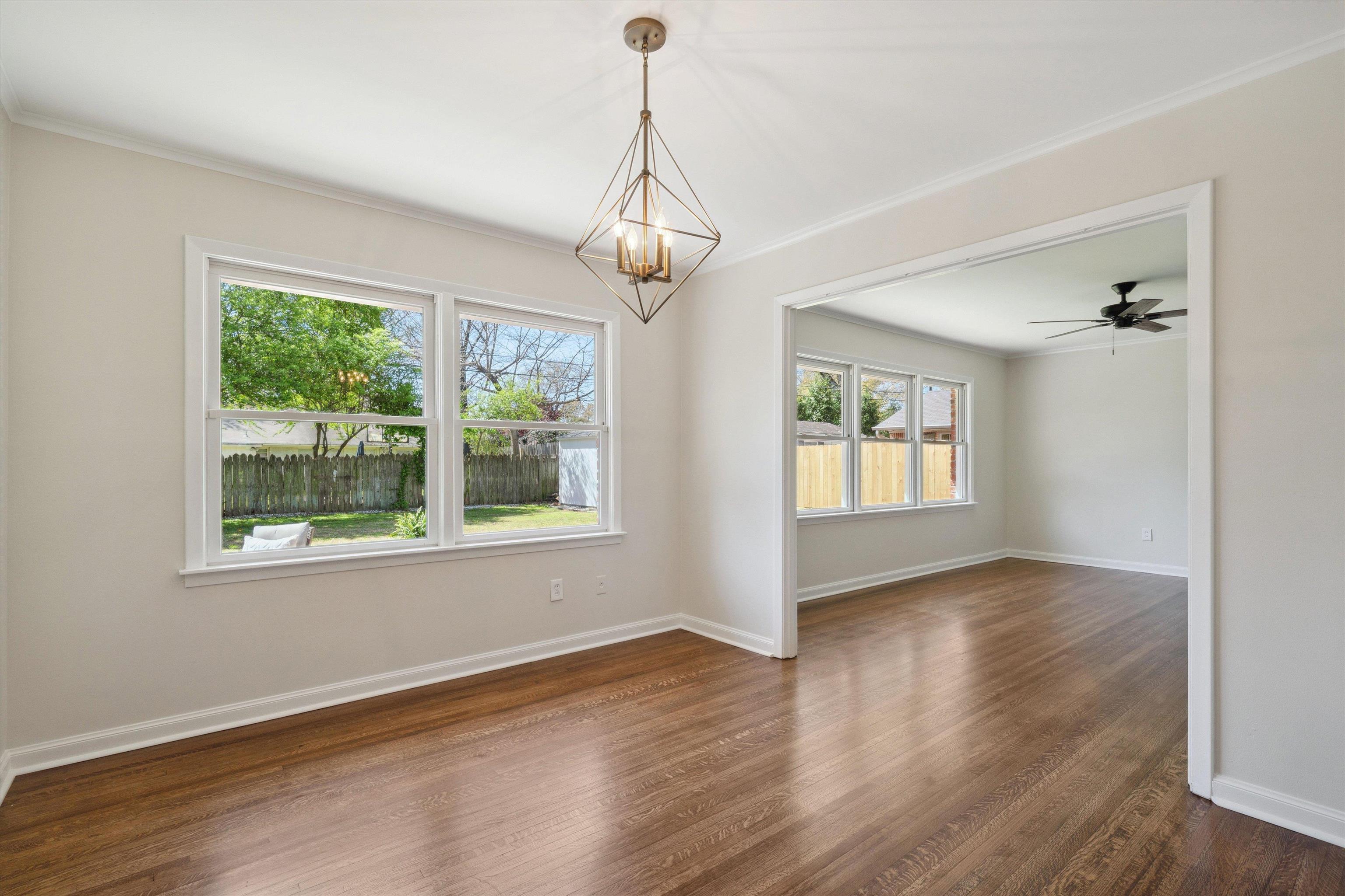 4821 Dee Road Memphis, TN 38117 - Photo 8 of 25 a view of an empty room with wooden floor and a window