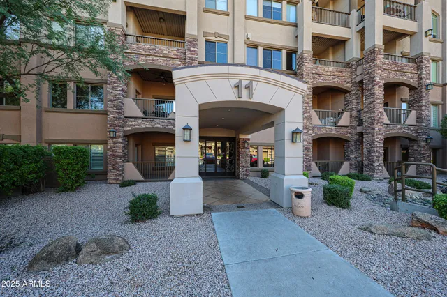 a front view of a building with garden