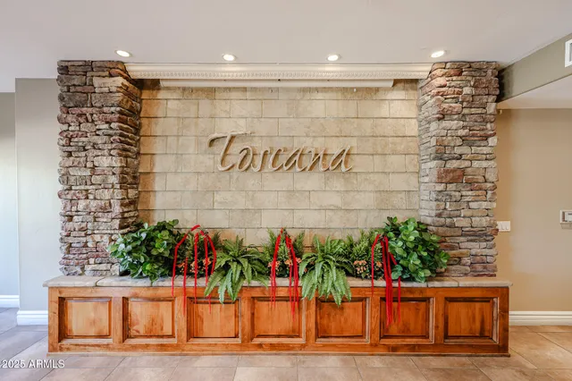 a view of a house with a yard and potted plants