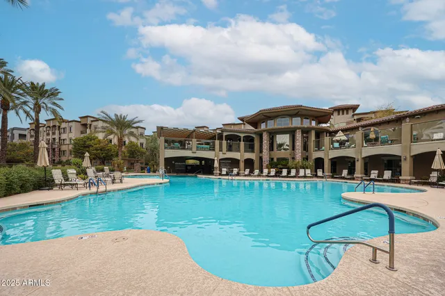 a front view of a building with outdoor seating