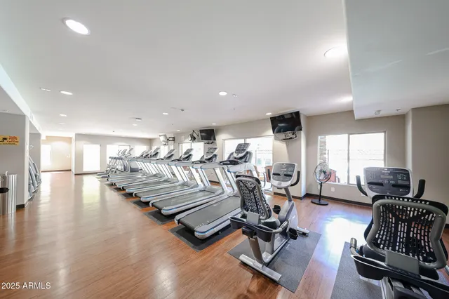 a picture of a building with table and chairs