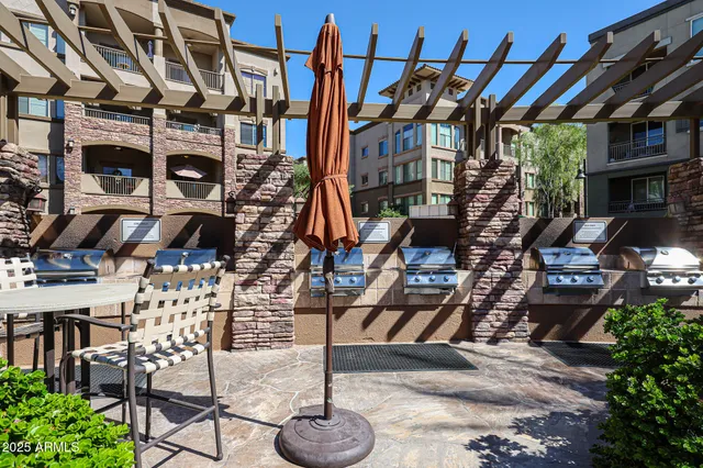 a swimming pool with outdoor seating and yard