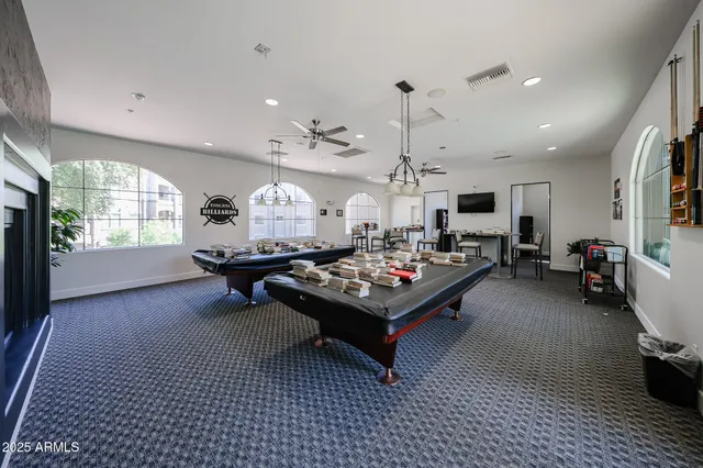 a large kitchen with a table and chairs