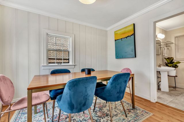 a living room with kitchen island furniture and a large window