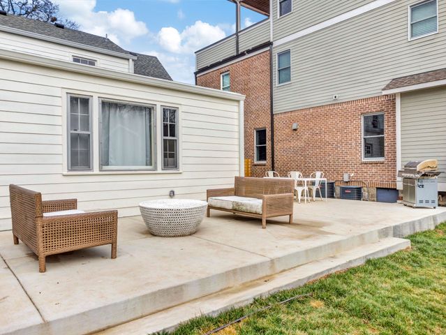 an aerial view of a house with swimming pool garden and patio