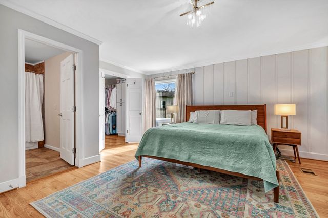 a bathroom with a double vanity sink toilet and shower