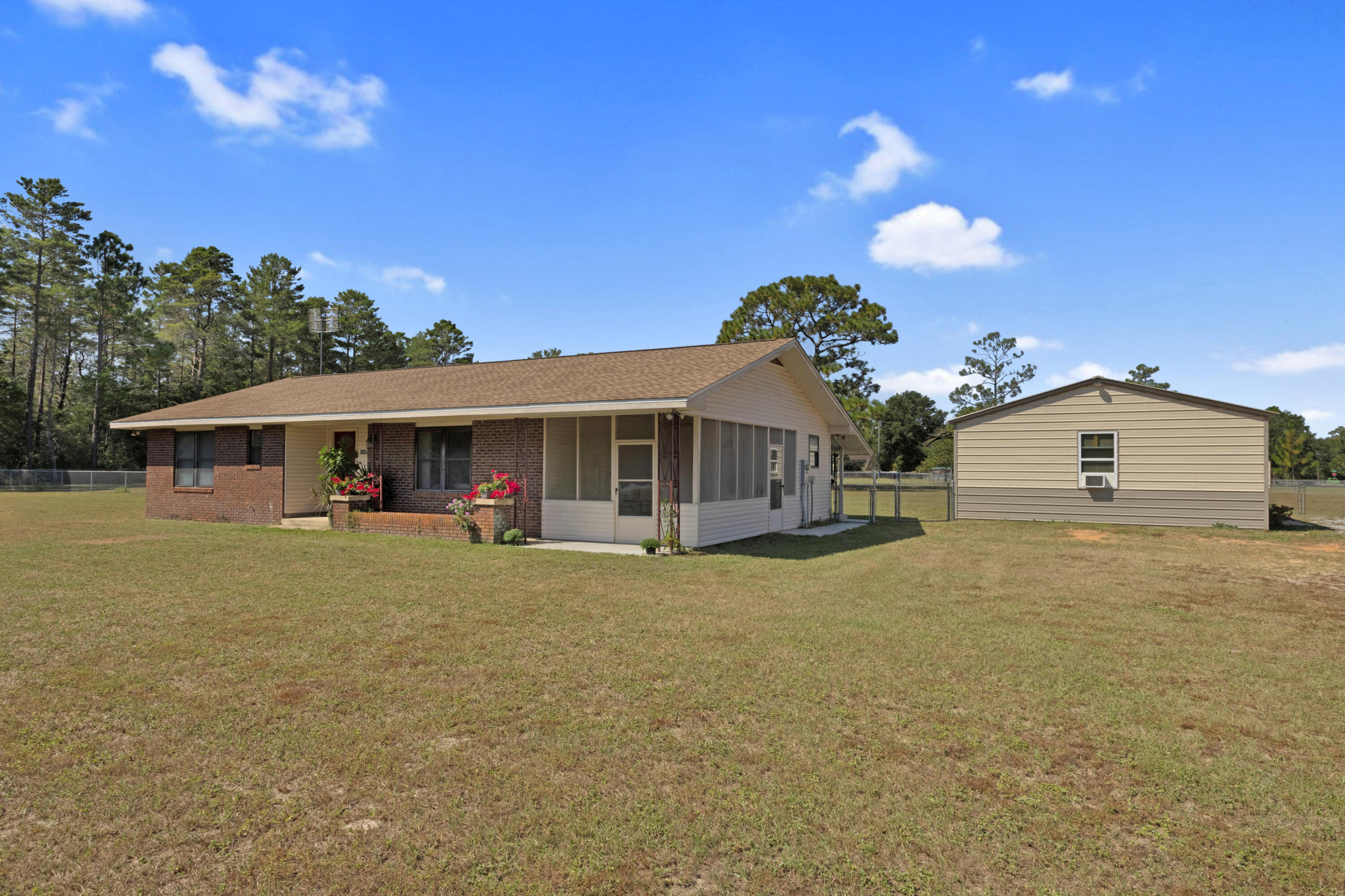 a front view of a house with a garden and porch