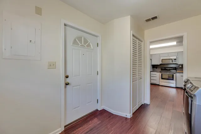 a view of kitchen with livingroom and hardwood floor