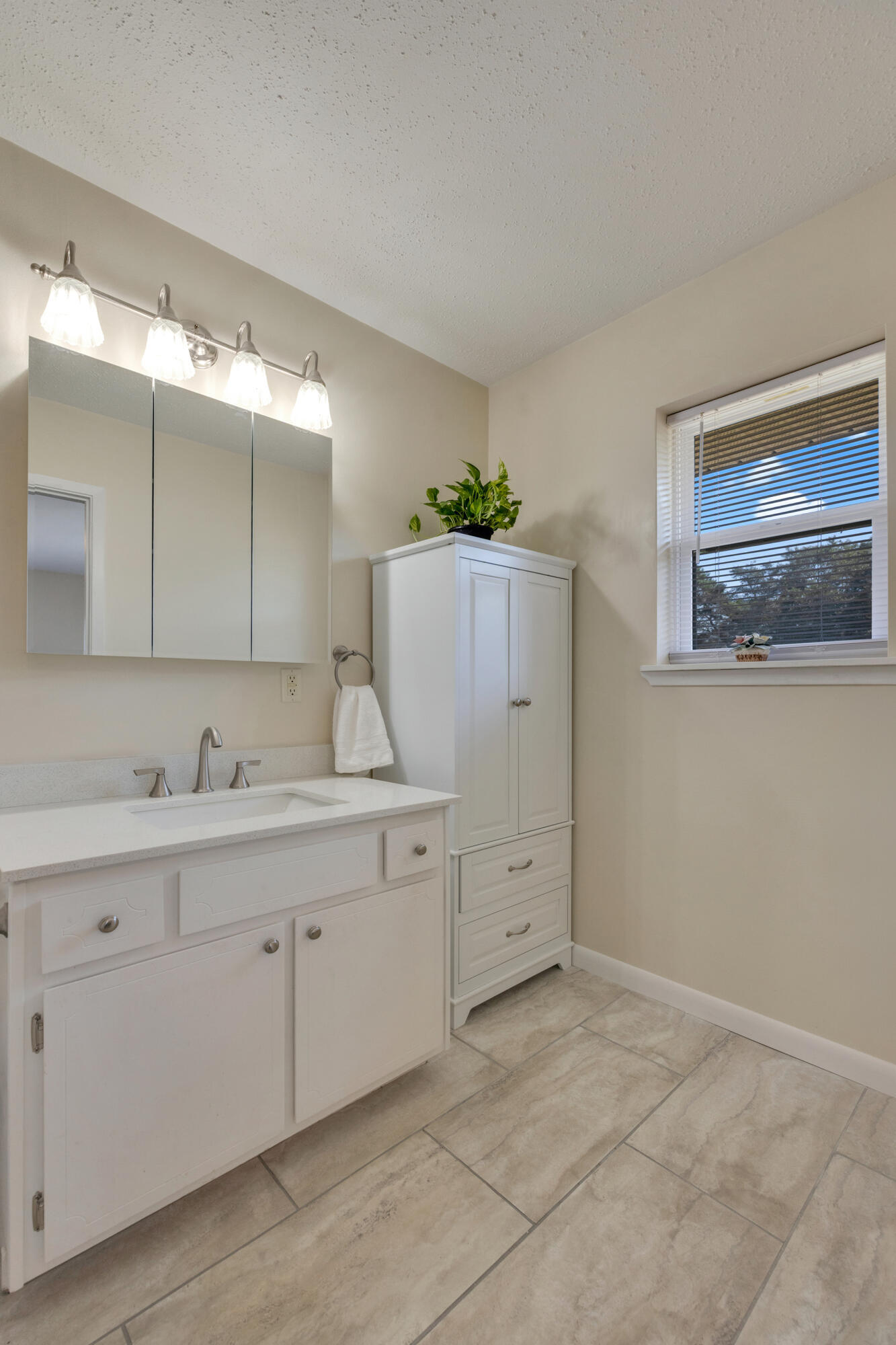 5448 Mt Olive Road Crestview, FL 32539 - Photo 18 of 37 a bathroom with a sink and a mirror