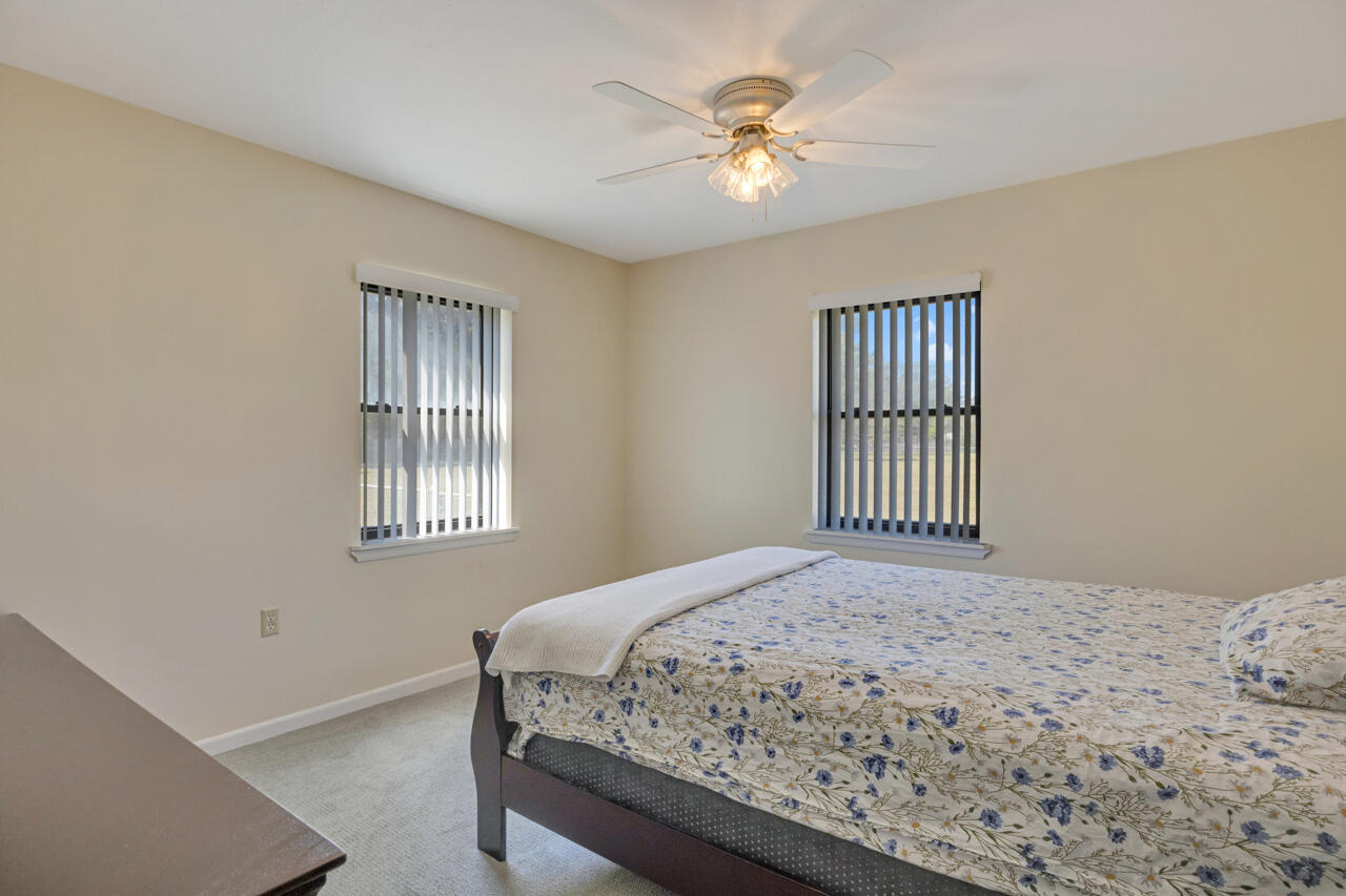 5448 Mt Olive Road Crestview, FL 32539 - Photo 19 of 37 a bedroom with a bed and a window