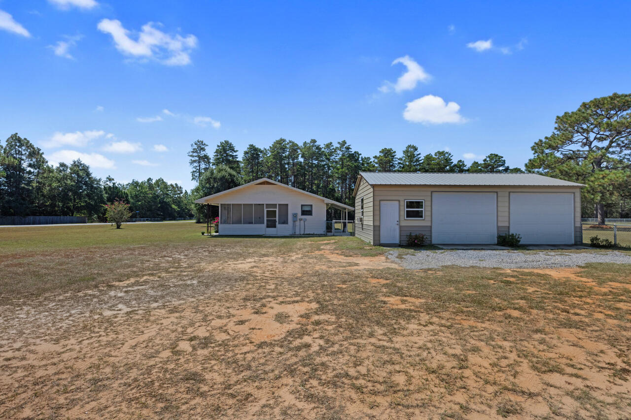 5448 Mt Olive Road Crestview, FL 32539 - Photo 29 of 37 a large tree in front of a house